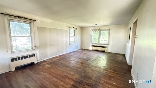 131 Bryden Terrace Hamden, CT 06517 - Photo 6 of 16 a view of an empty room with a window and wooden floor