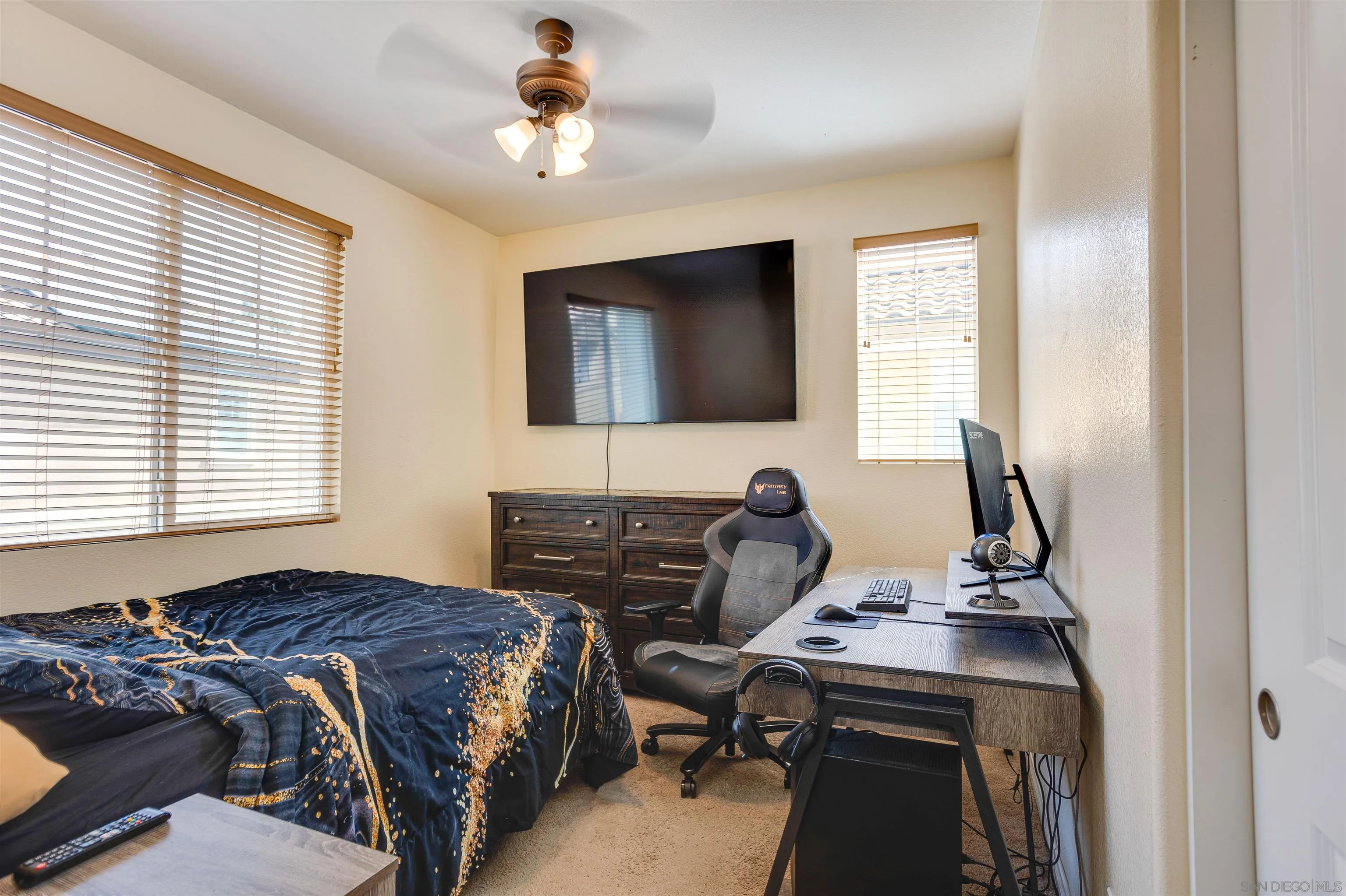 1447 Chert Drive San Marcos, CA 92078 - Photo 11 of 28 a bedroom with a bed and a flat screen tv