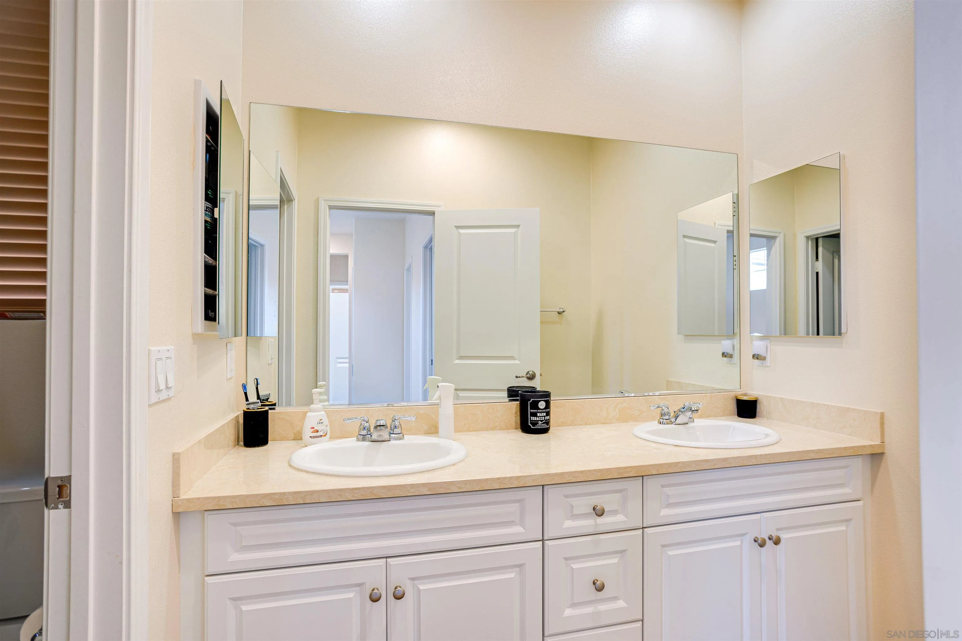 1447 Chert Drive San Marcos, CA 92078 - Photo 15 of 28 a bathroom with a sink and a mirror