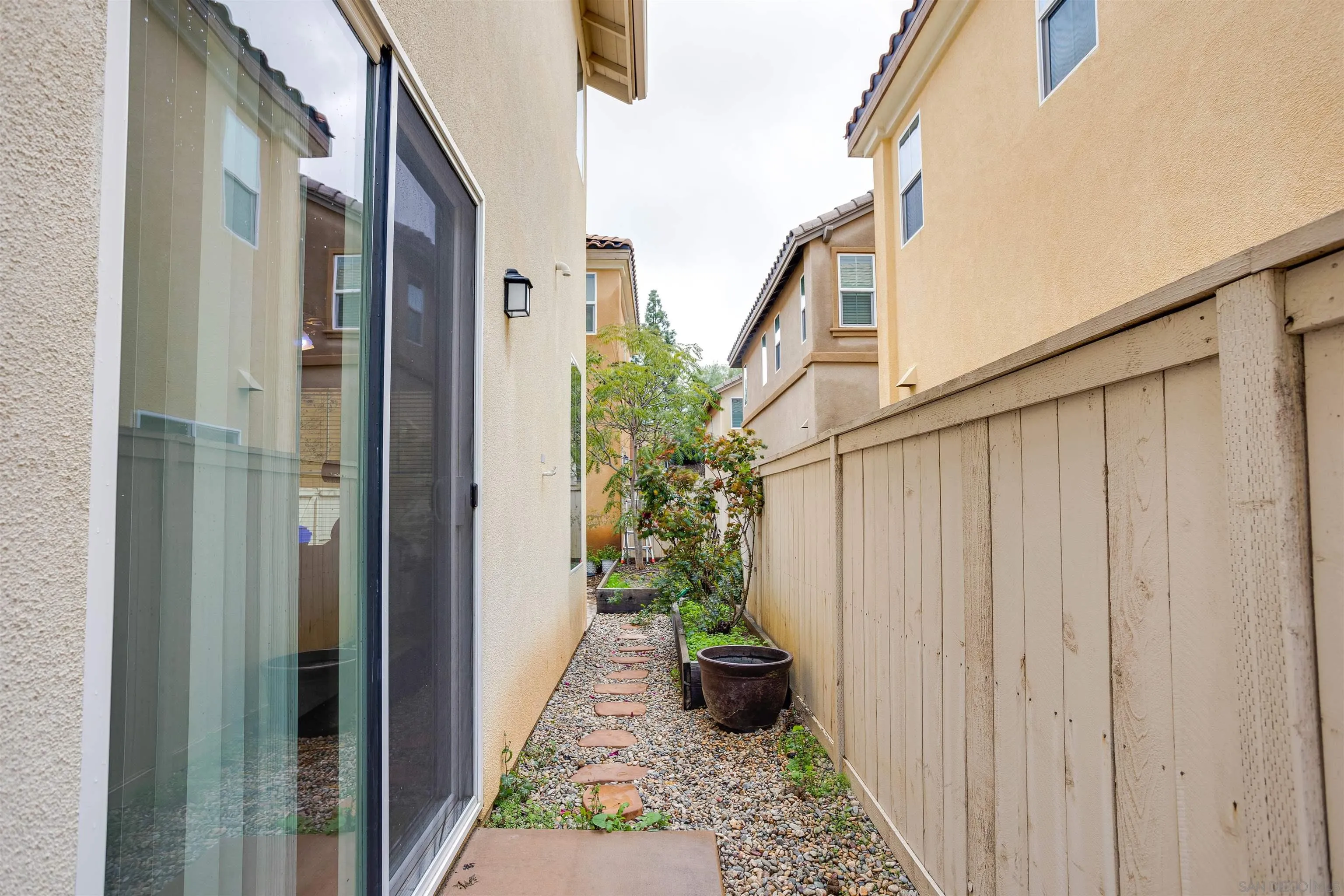 1447 Chert Drive San Marcos, CA 92078 - Photo 20 of 28 a view of a pathway of a house with potted plants