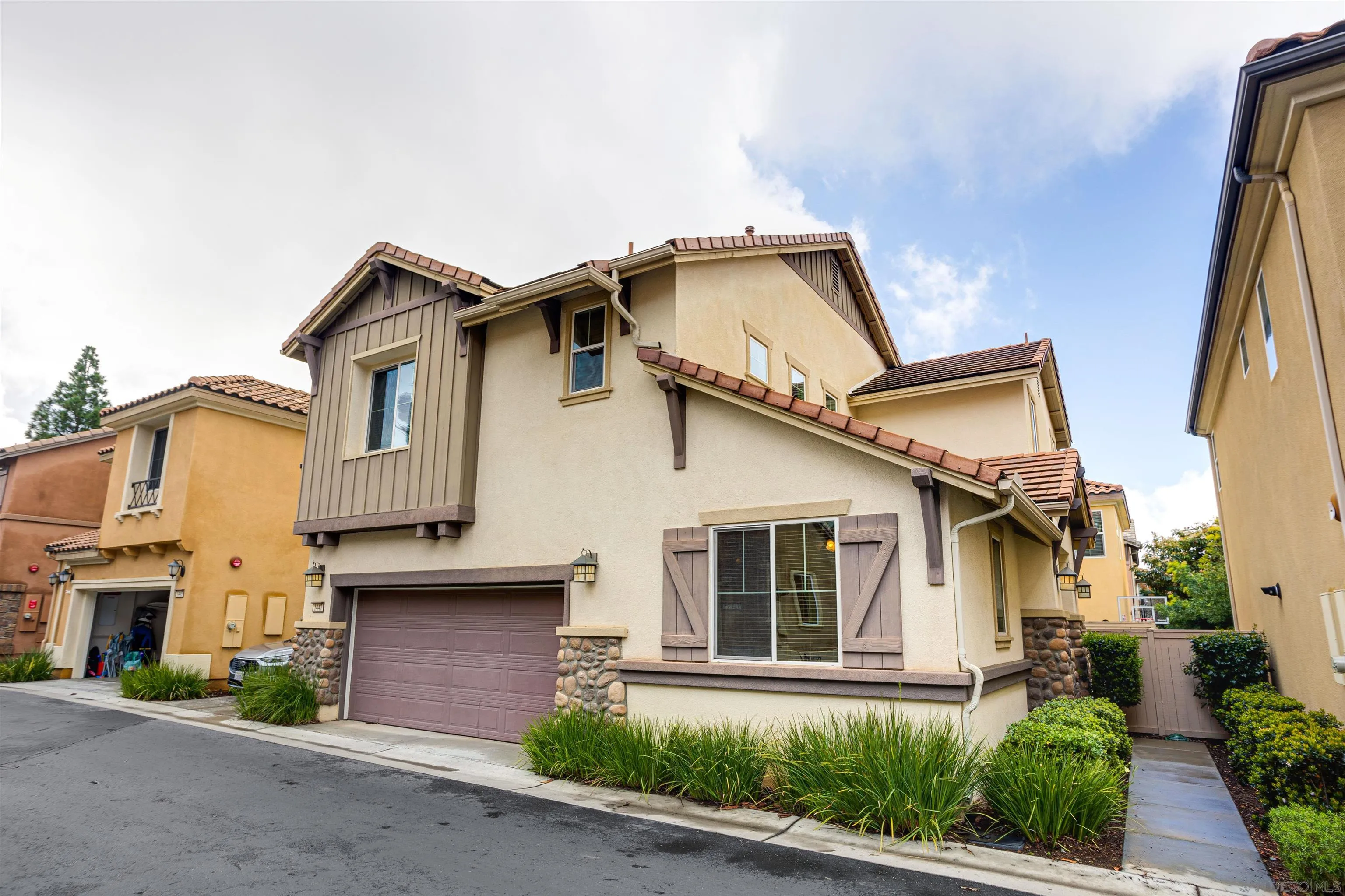 1447 Chert Drive San Marcos, CA 92078 - Photo 24 of 28 a front view of a house with a yard