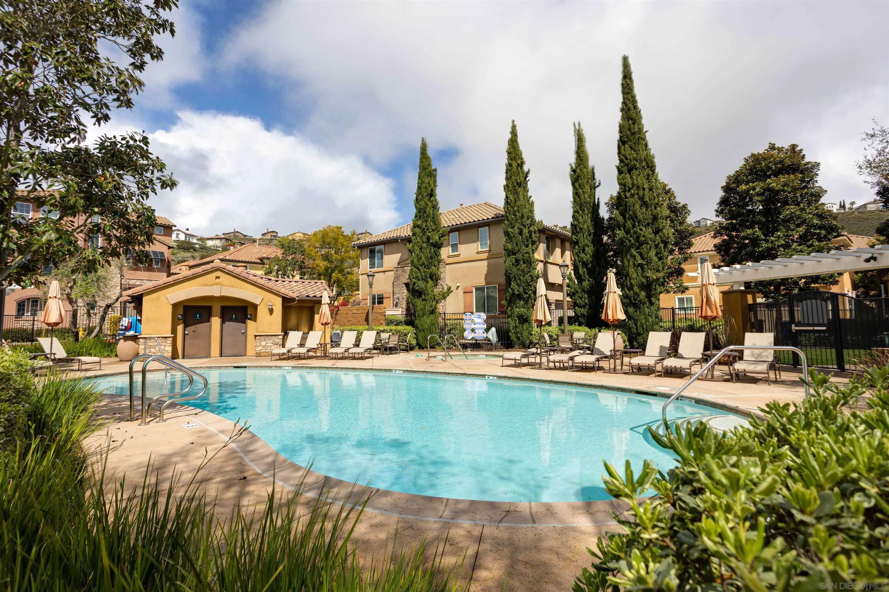 1447 Chert Drive San Marcos, CA 92078 - Photo 28 of 28 a view of a lake with a building and a big yard with plants