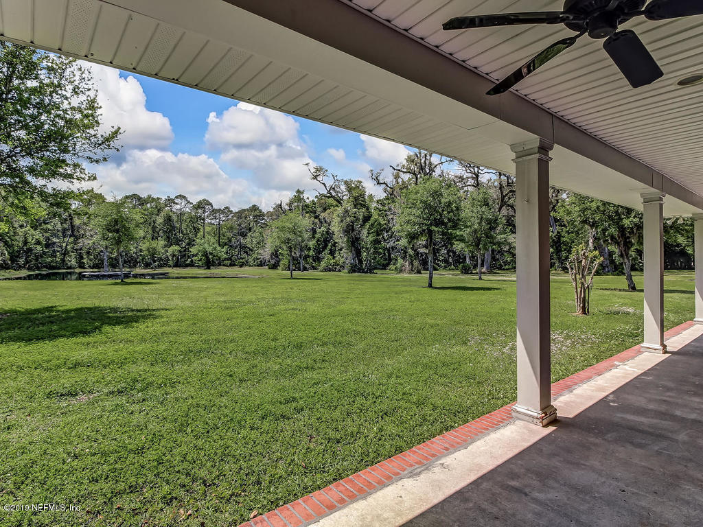 86051 Ellis Estates Landing Road Yulee, FL 32097 - Photo 20 of 35 a view of a patio with a yard