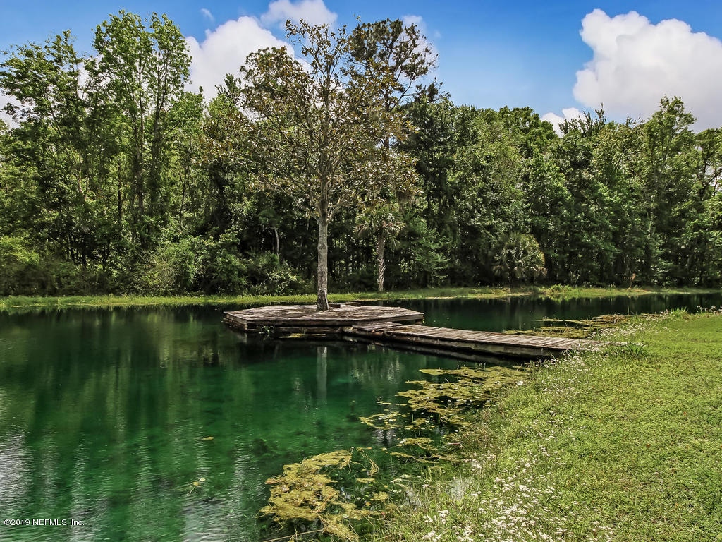 86051 Ellis Estates Landing Road Yulee, FL 32097 - Photo 26 of 35 a view of a lake with a yard