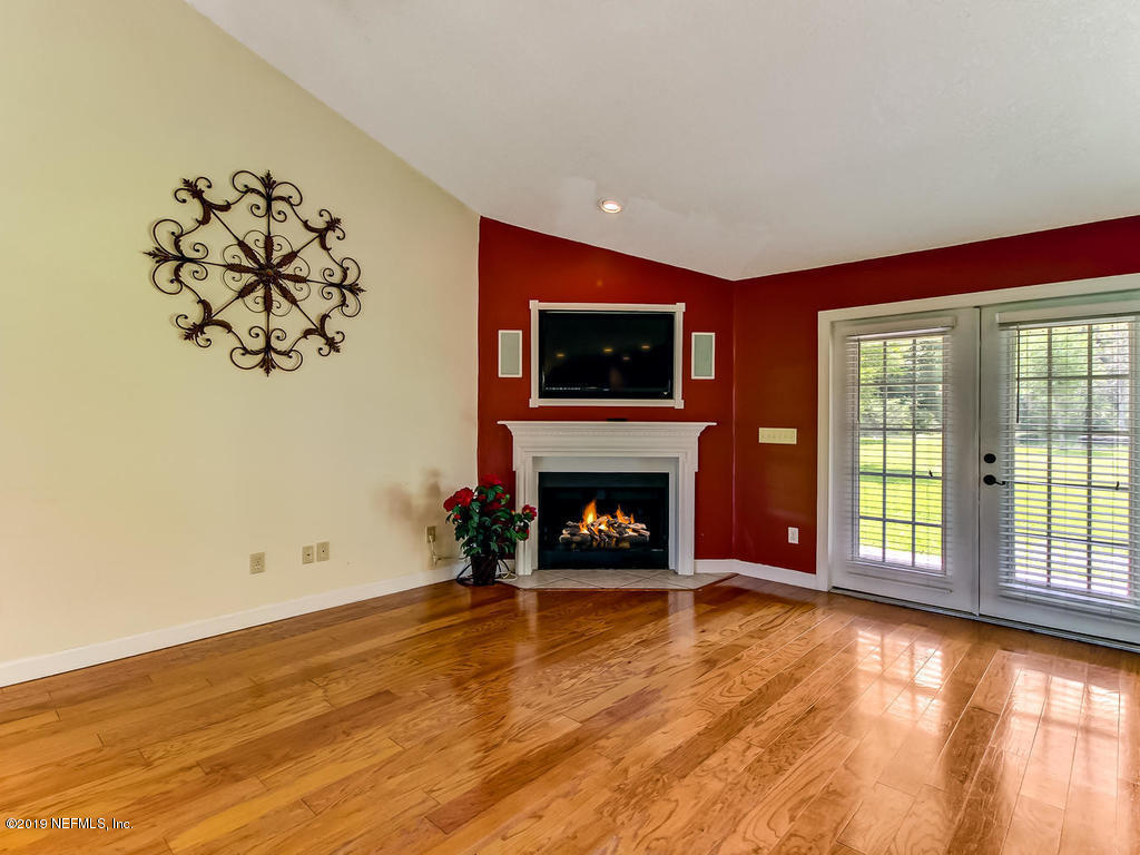 86051 Ellis Estates Landing Road Yulee, FL 32097 - Photo 4 of 35 a view of a livingroom with a fireplace and window