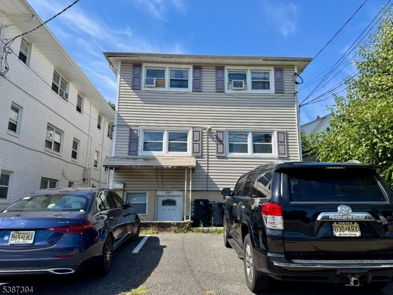 687 Midland Avenue, Unit 2 Garfield, NJ 07026 - Photo 1 of 11 a car parked in front of a building