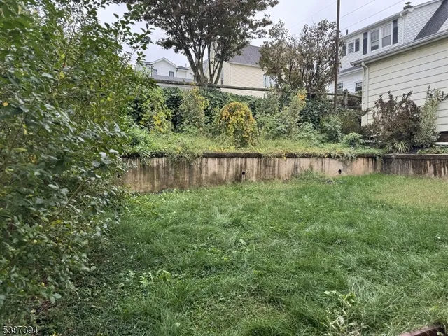 a view of a lake with a house in the background