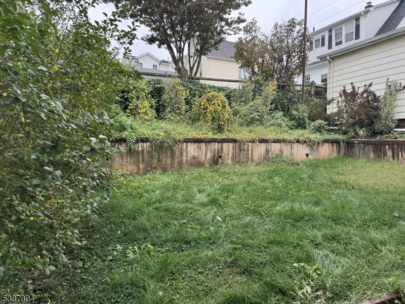 687 Midland Avenue, Unit 2 Garfield, NJ 07026 - Photo 11 of 11 a view of a lake with a house in the background