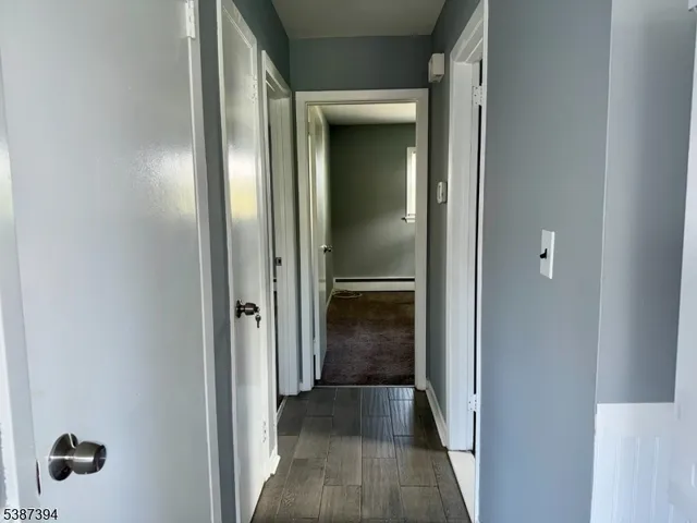 a view of a bathroom from the hallway