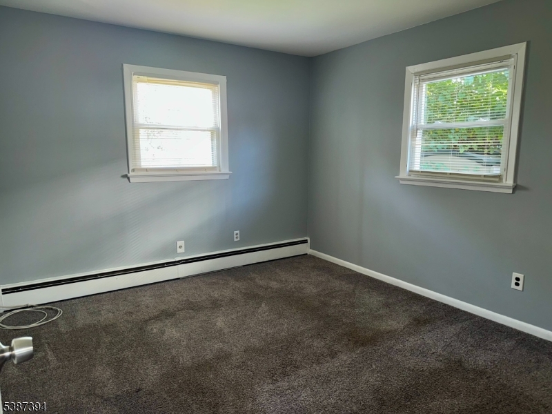 687 Midland Avenue, Unit 2 Garfield, NJ 07026 - Photo 9 of 11 an empty room with a window