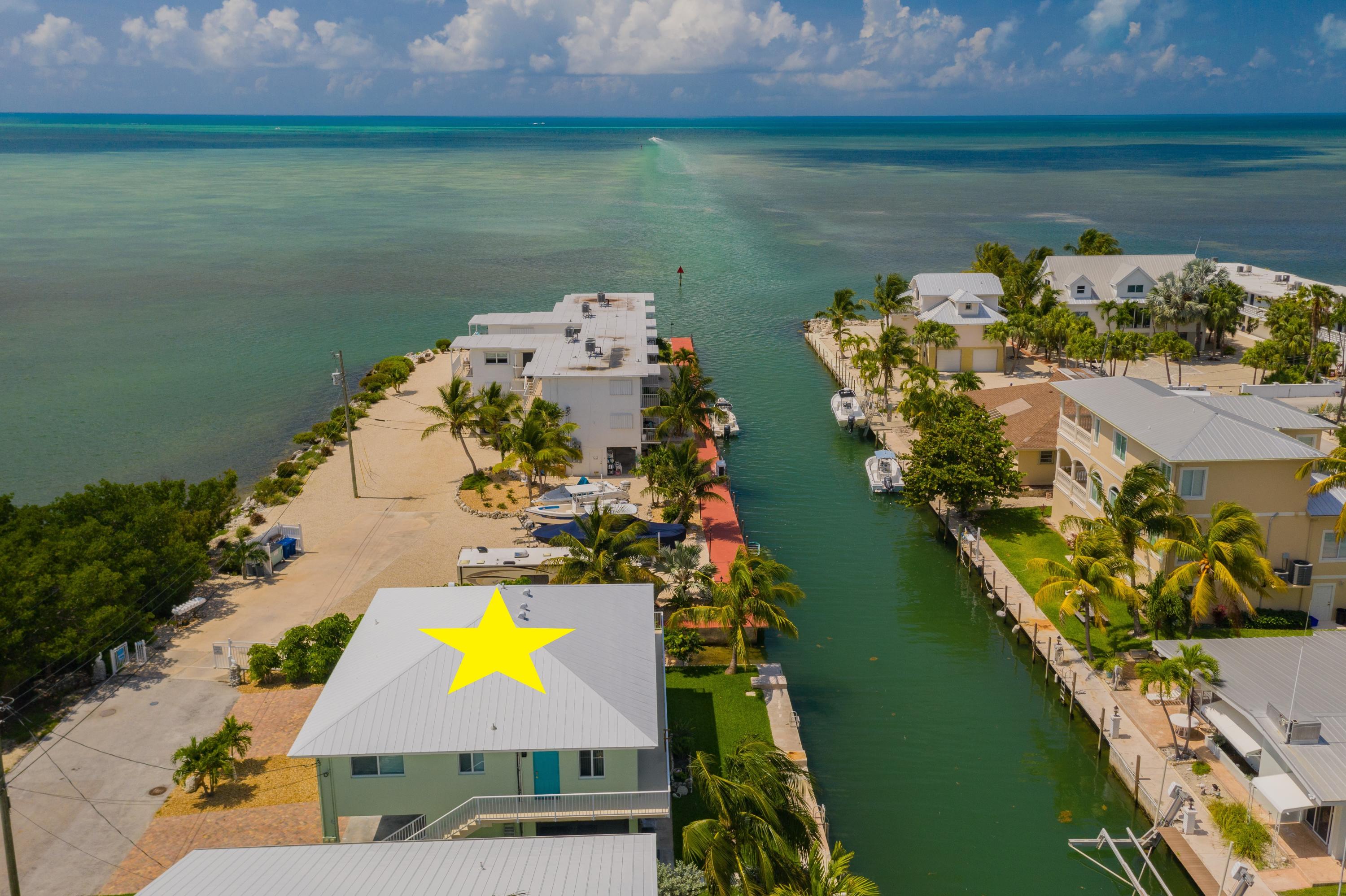 945 98th Street Marathon, FL 33050 - Photo 2 of 49 an aerial view of a house with a lake view