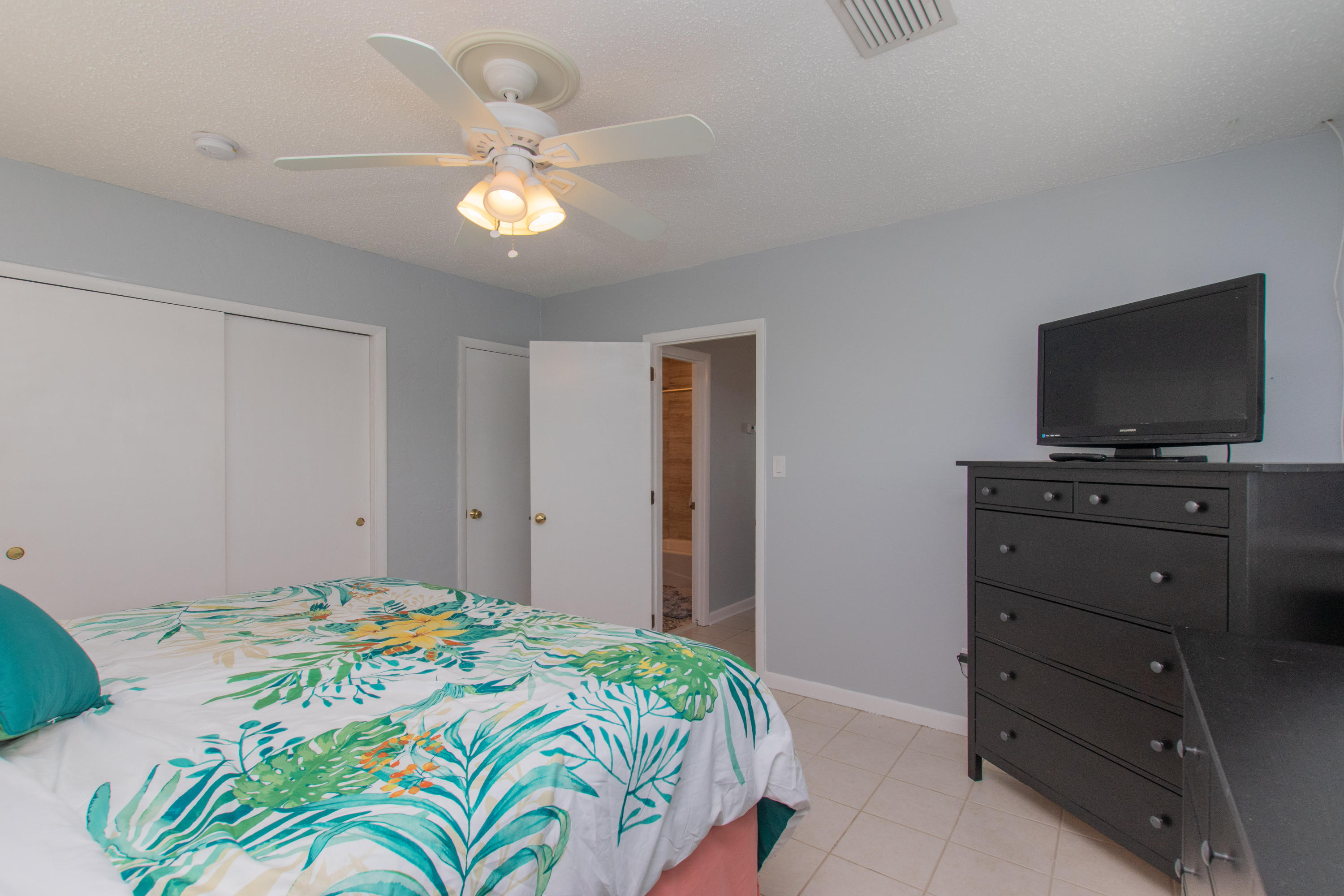 945 98th Street Marathon, FL 33050 - Photo 14 of 49 a bedroom with a bed and a flat screen tv