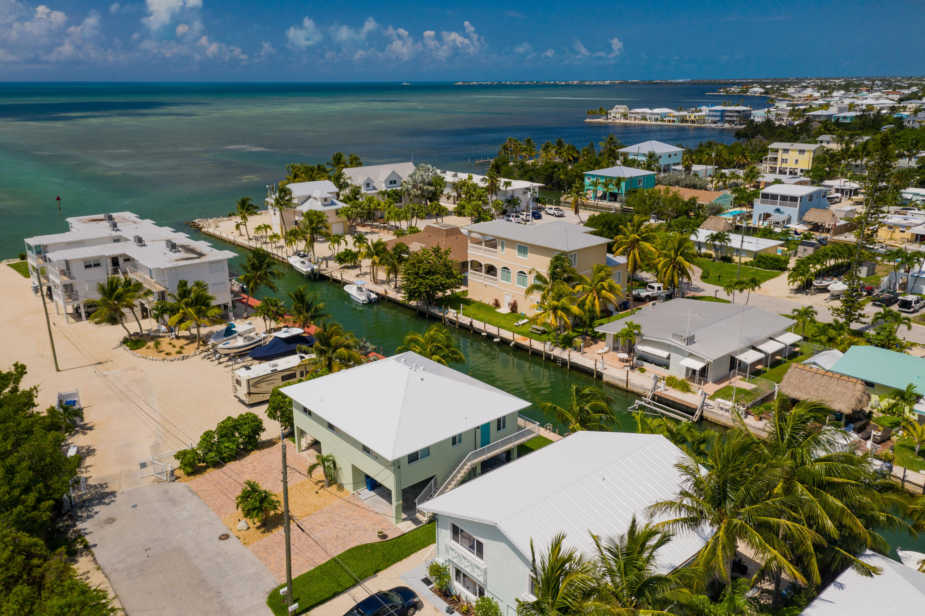 945 98th Street Marathon, FL 33050 - Photo 3 of 49 an aerial view of a house with a lake view