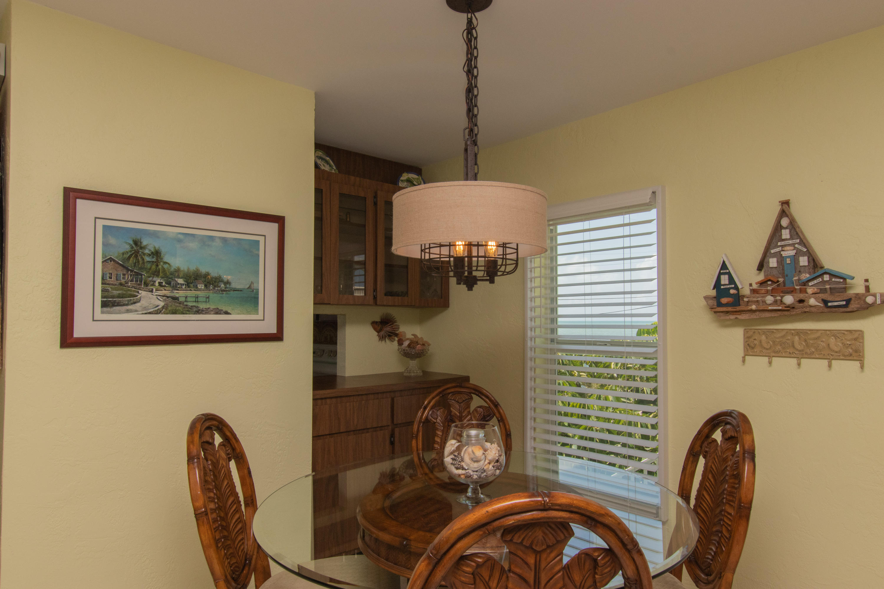 945 98th Street Marathon, FL 33050 - Photo 23 of 49 a front view of a house with outdoor seating