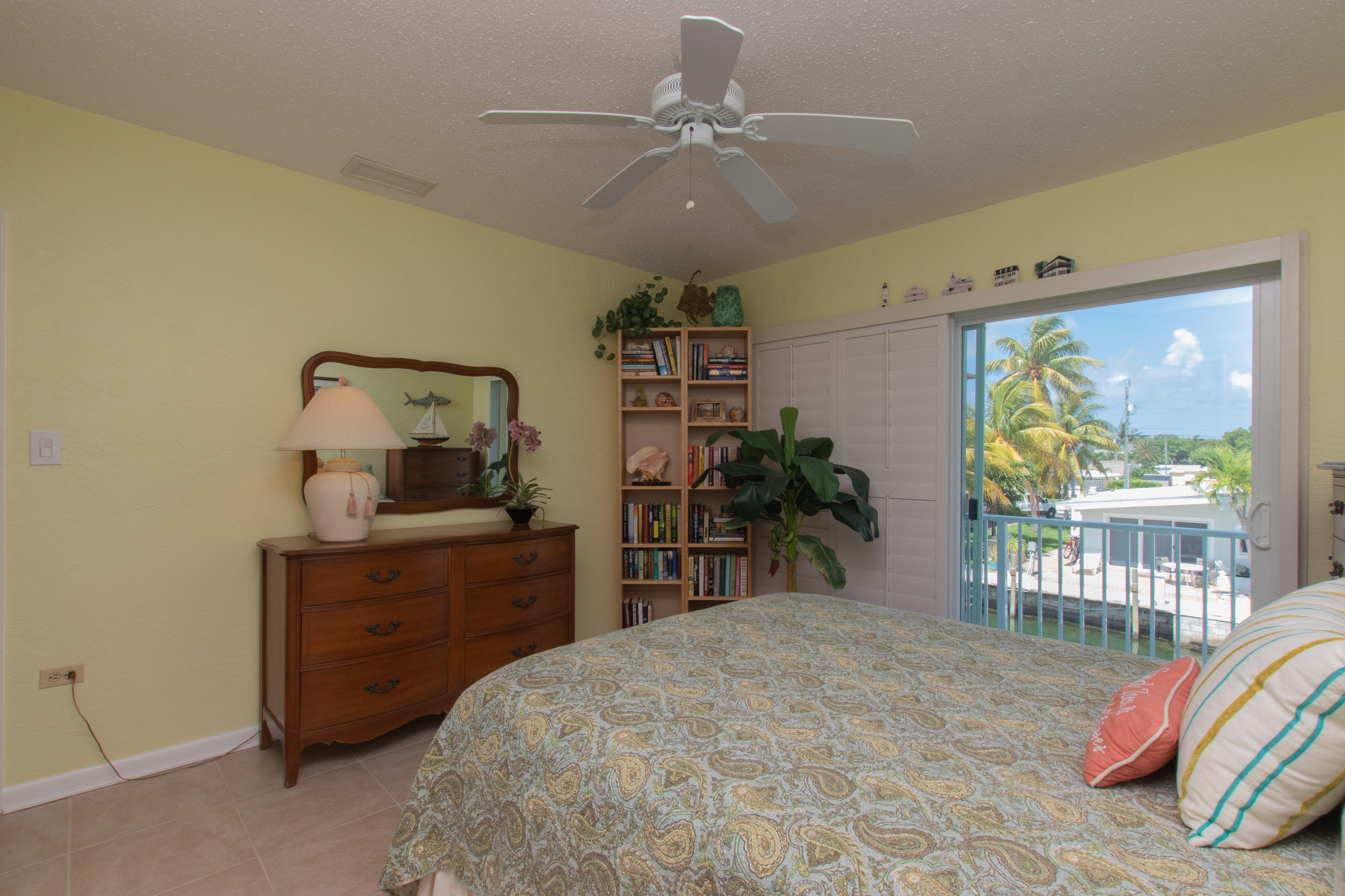 945 98th Street Marathon, FL 33050 - Photo 27 of 49 a bed room with a bed and a television