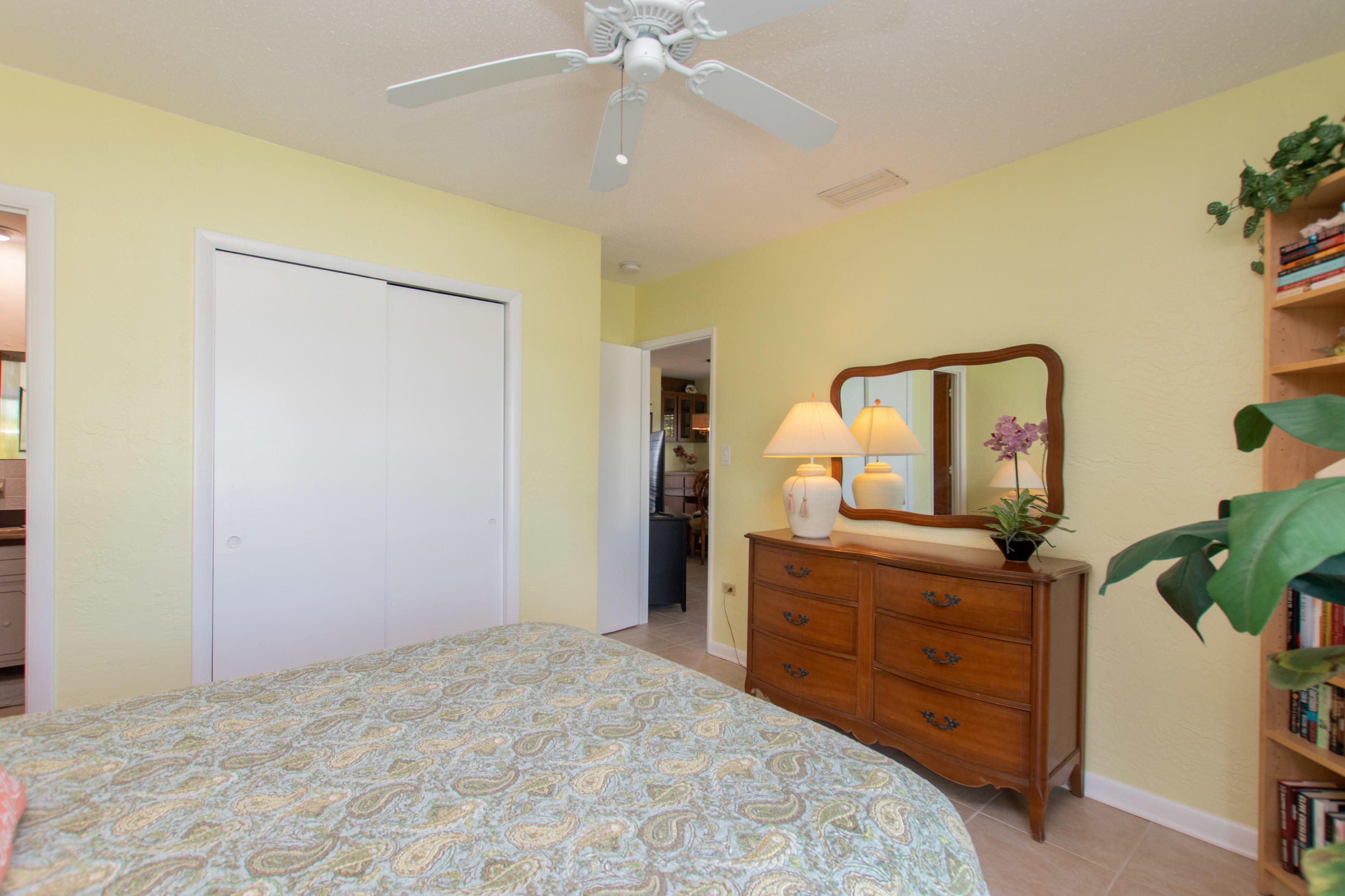 945 98th Street Marathon, FL 33050 - Photo 29 of 49 a bedroom with a bed and a dresser