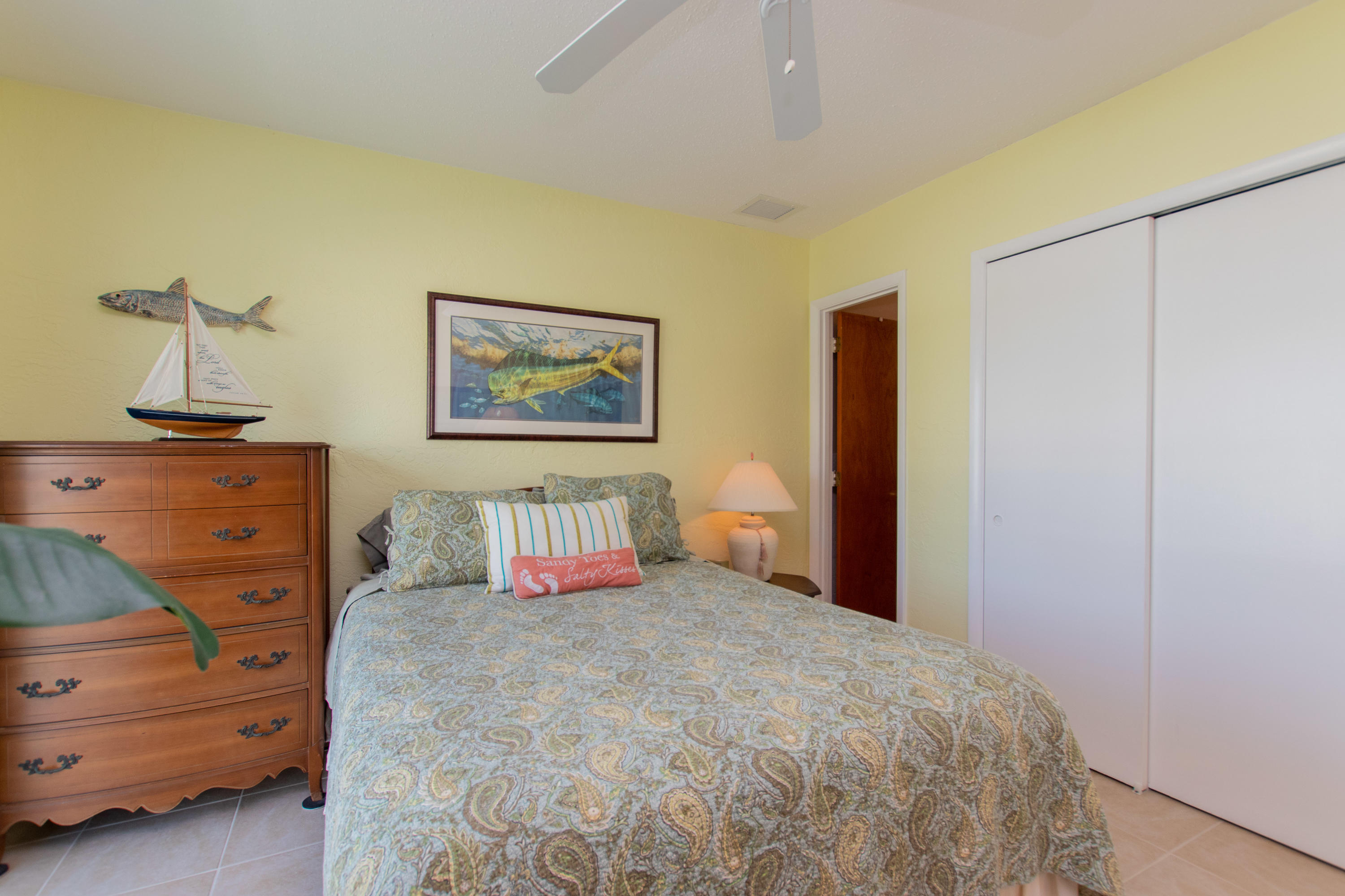 945 98th Street Marathon, FL 33050 - Photo 30 of 49 a bedroom with a bed and a cabinets