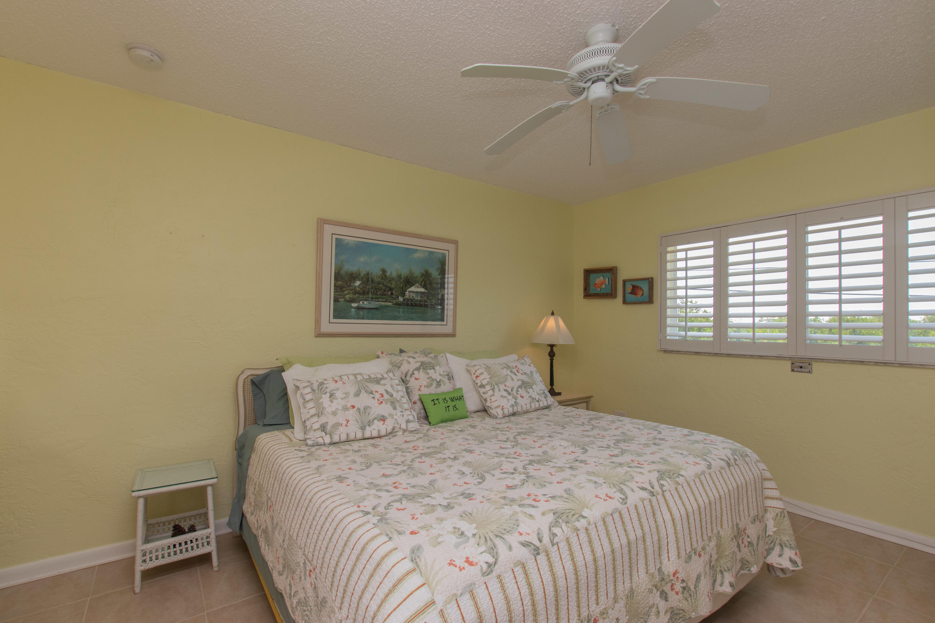 945 98th Street Marathon, FL 33050 - Photo 32 of 49 a bedroom with a bed and a window