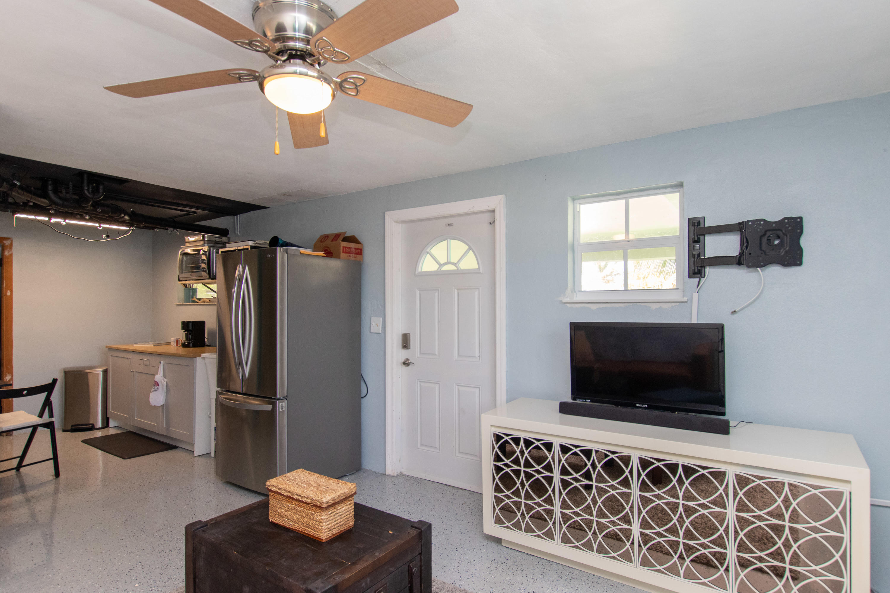 945 98th Street Marathon, FL 33050 - Photo 38 of 49 a living room with furniture and a flat screen tv