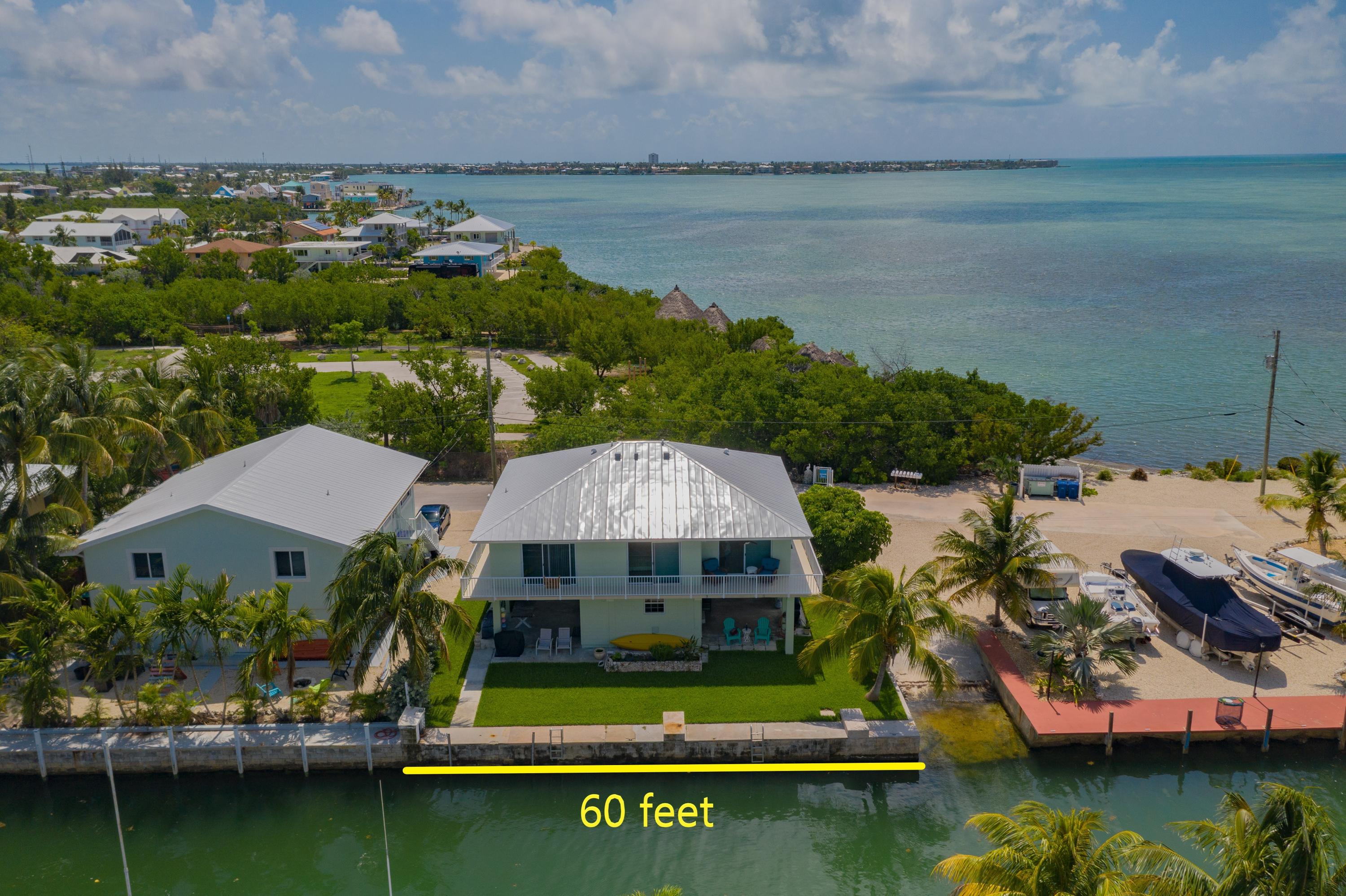 945 98th Street Marathon, FL 33050 - Photo 47 of 49 a view of a lake with a house in the background