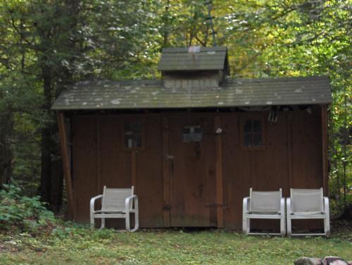58 Cronk Road Monterey, MA 01245 - Photo 7 of 17 a backyard of a house with table and chairs