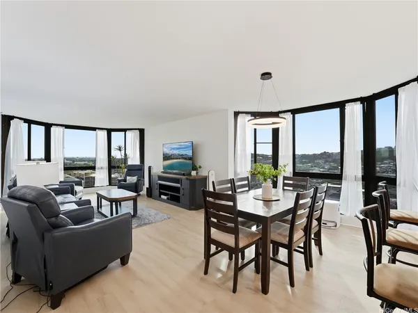 a view of a dining room with furniture window and outside view