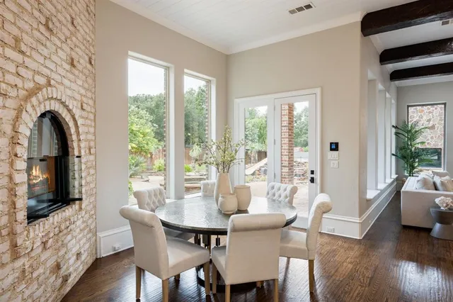 a large white kitchen with a stove and a sink
