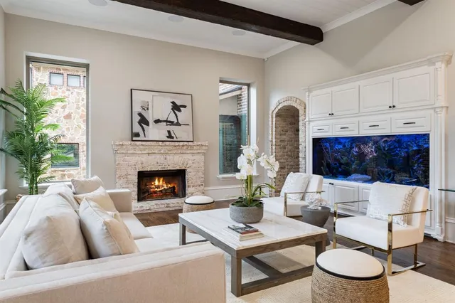 a kitchen with a sink and a refrigerator with wooden floor