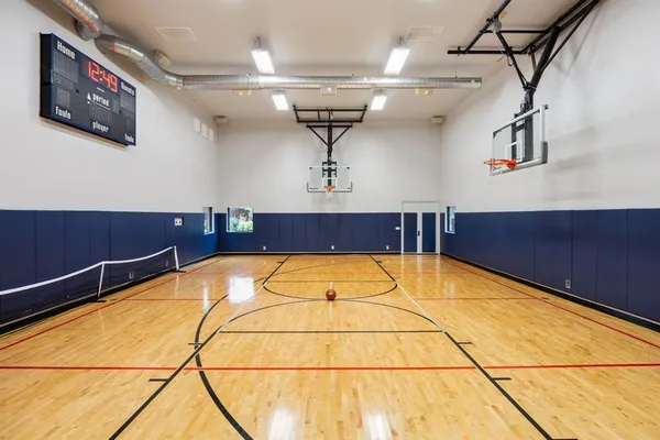 a bed room with furniture and gym equipment