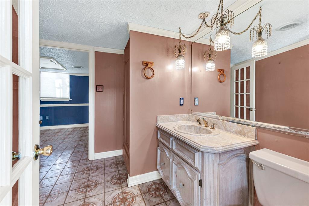 501 Colgate Drive Lancaster, TX 75134 - Photo 11 of 13 a bathroom with a sink a toilet and shower