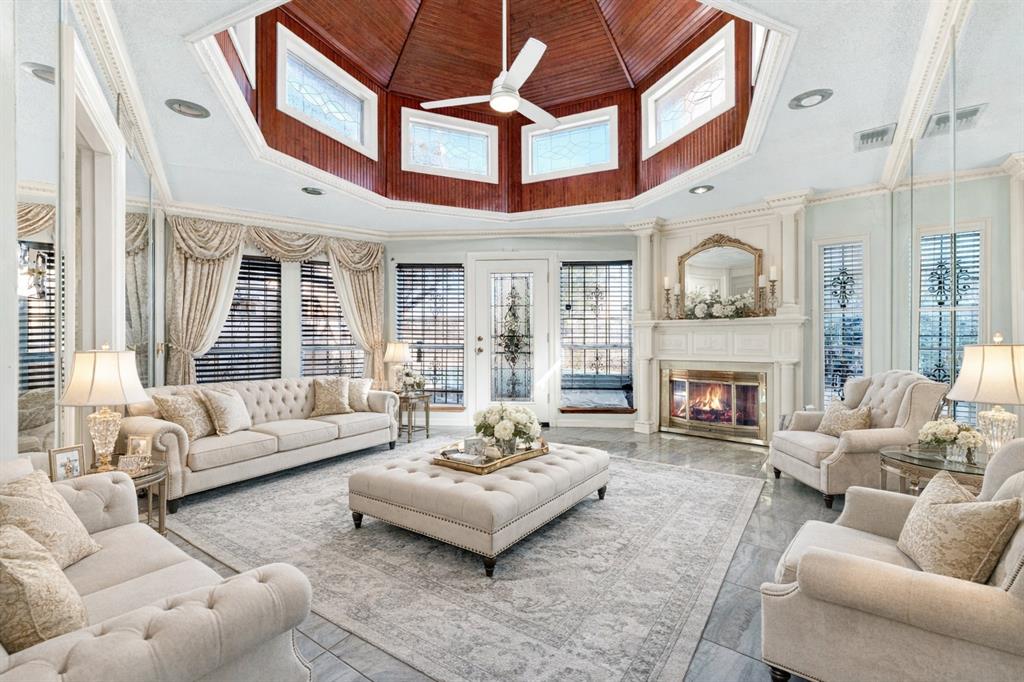 501 Colgate Drive Lancaster, TX 75134 - Photo 2 of 13 a living room with furniture a fireplace and a large window