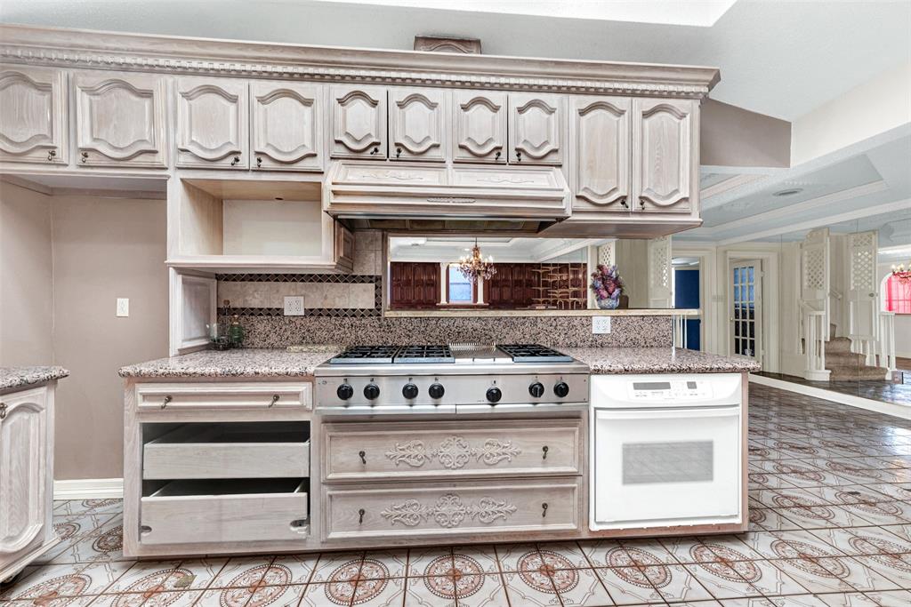 501 Colgate Drive Lancaster, TX 75134 - Photo 6 of 13 a stove top oven sitting inside of a kitchen