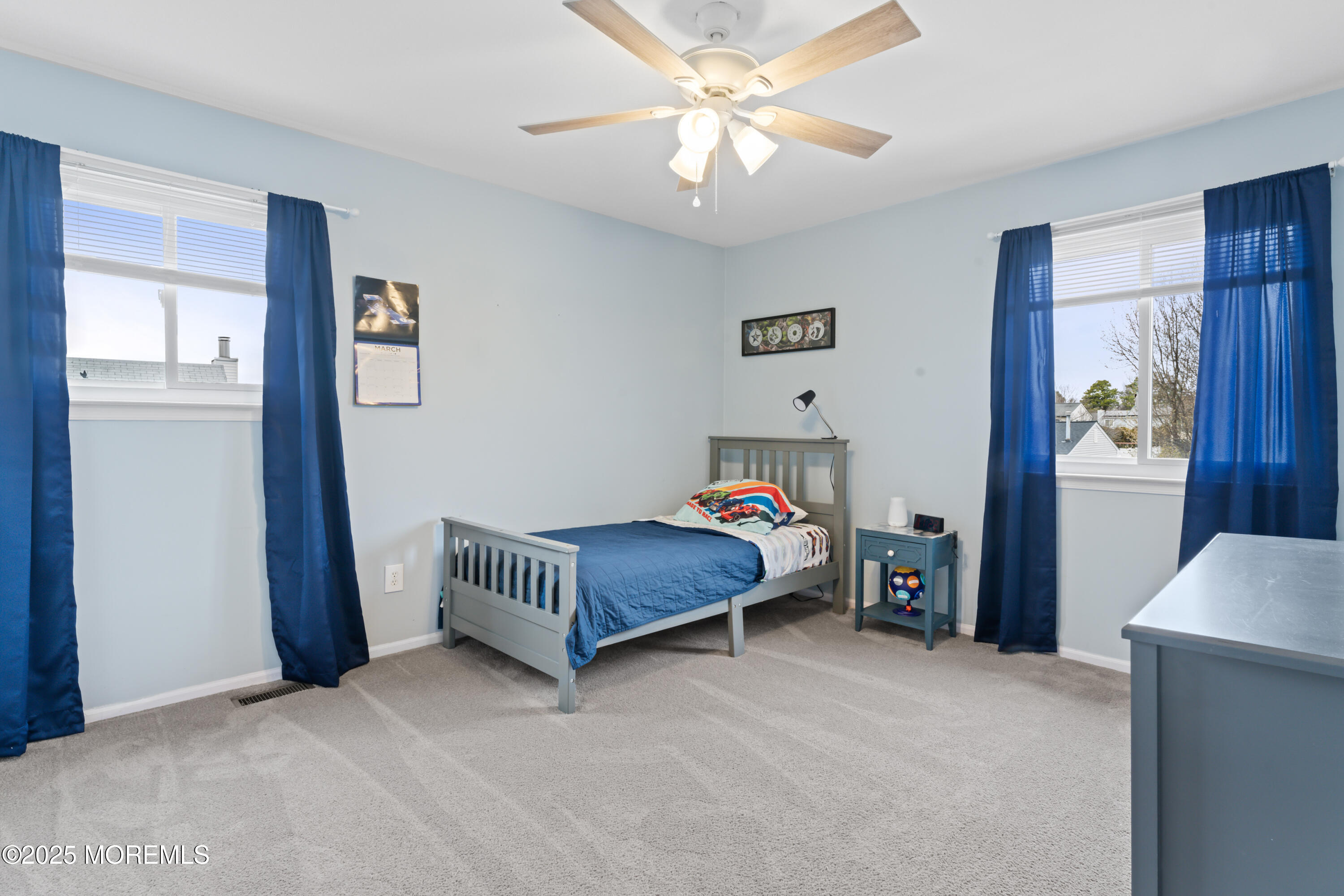 6 Blueberry Path Howell, NJ 07731 - Photo 20 of 38 a bedroom with a bed and a chandelier