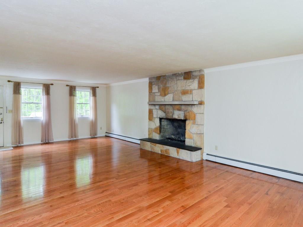 115 Syl Road Sewickley, PA 15143 - Photo 2 of 20 Large living/great room with hardwood floors and log burning fireplace