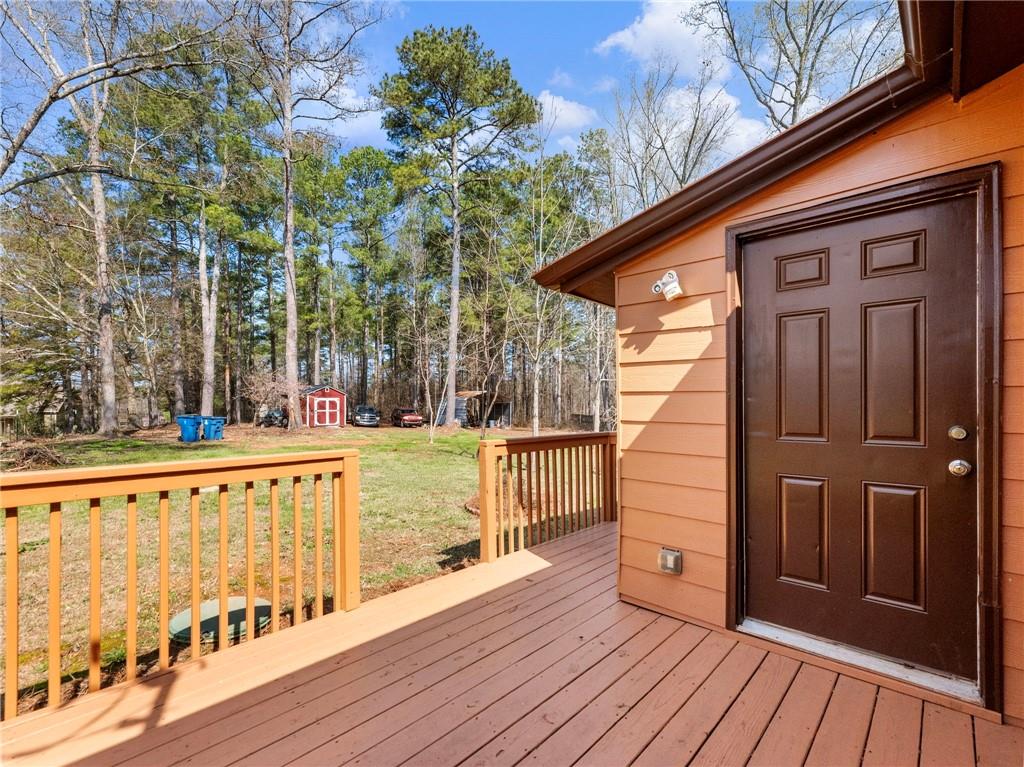 1686 Shoal Creek Road Monroe, GA 30656 - Photo 34 of 50 a view of balcony with wooden floor and fence