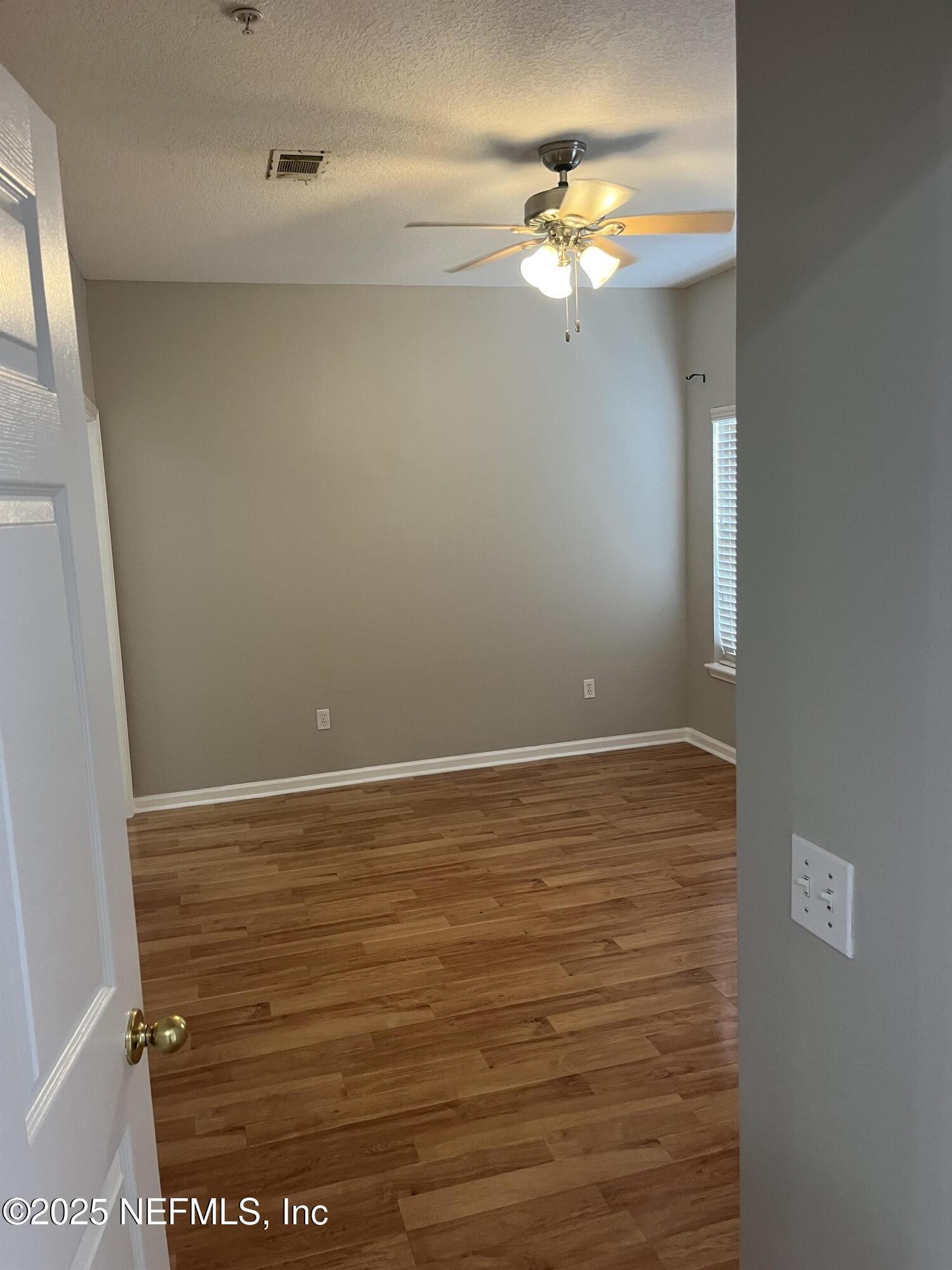 3680 Kirkpatrick Circle, Unit 3 Jacksonville, FL 32210 - Photo 5 of 7 a view of a room with an empty space