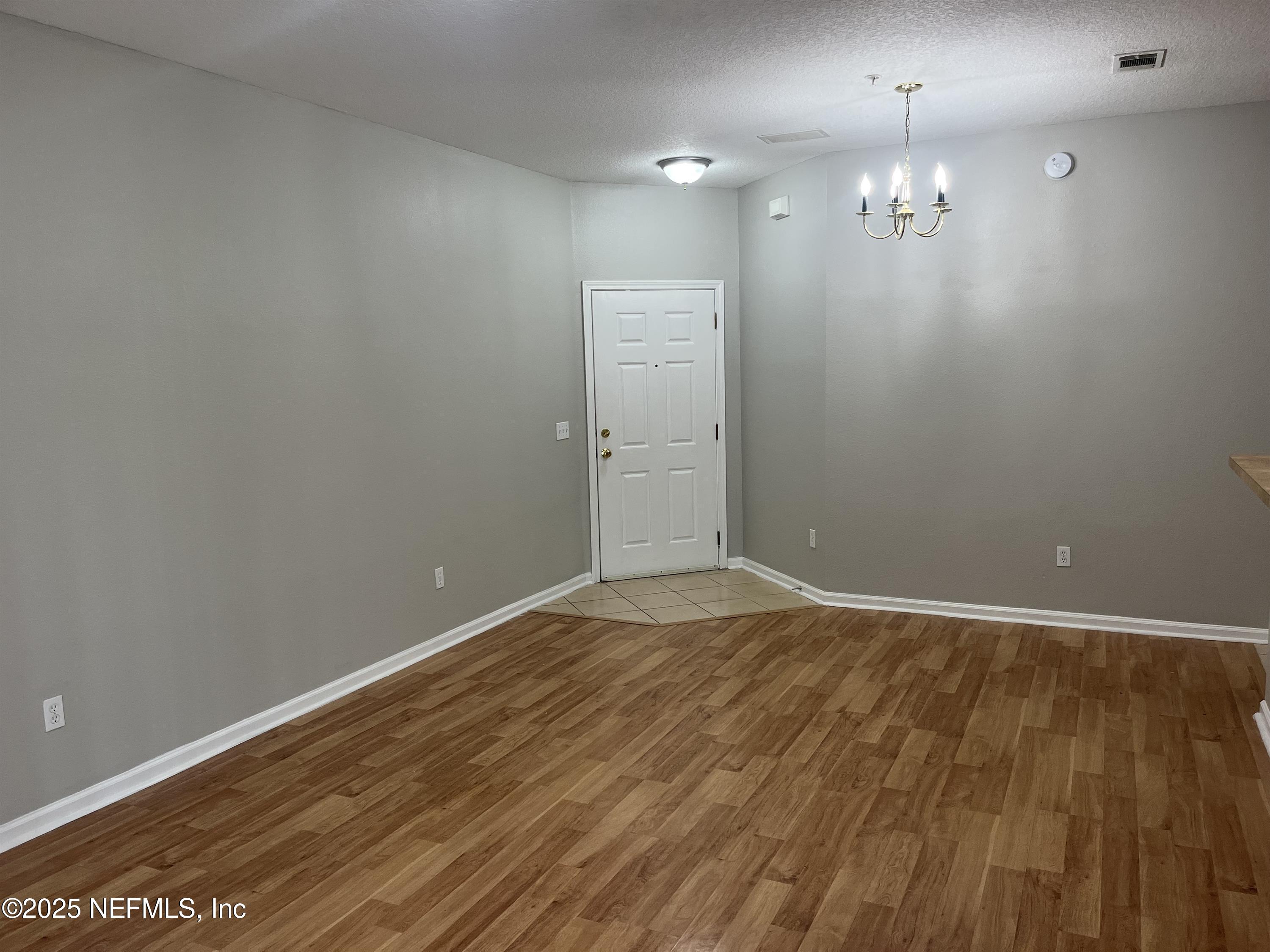 3680 Kirkpatrick Circle, Unit 3 Jacksonville, FL 32210 - Photo 6 of 7 wooden floor in an empty room