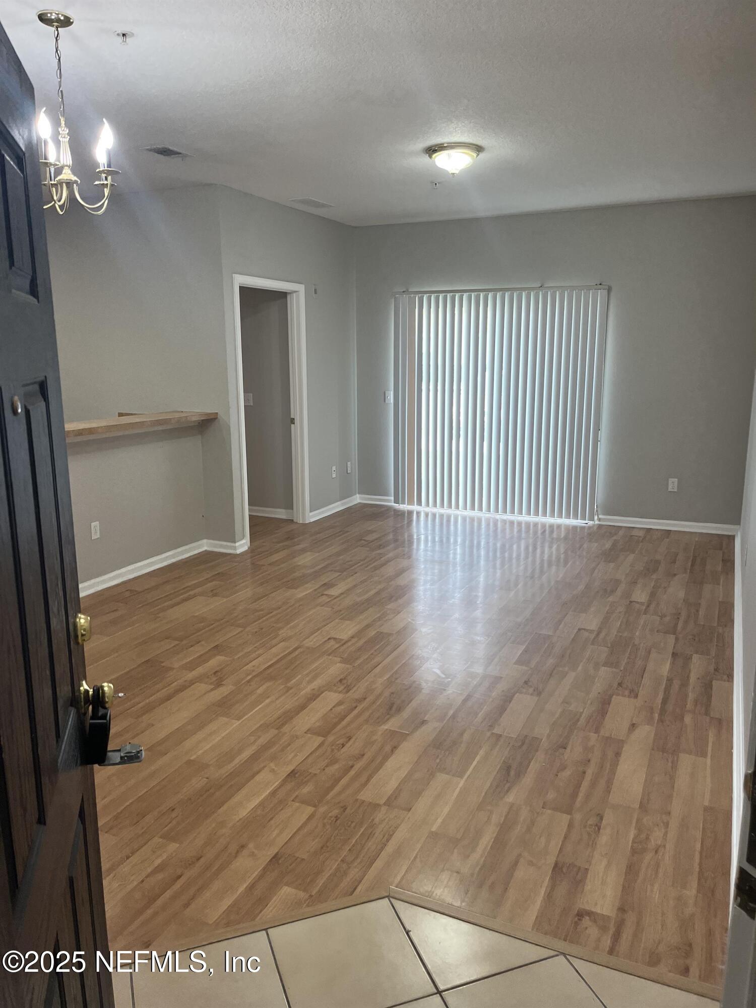 3680 Kirkpatrick Circle, Unit 3 Jacksonville, FL 32210 - Photo 7 of 7 a view of a livingroom with a staircase