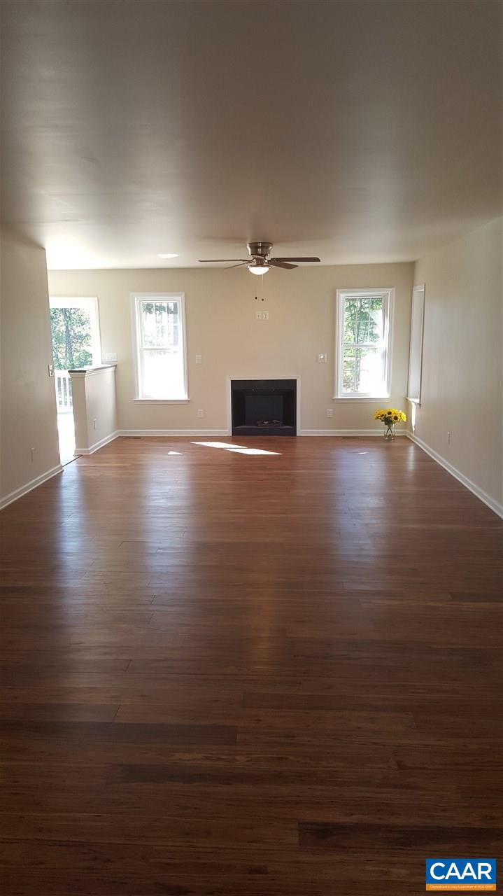 995 Bibb Store Road Louisa, VA 23093 - Photo 8 of 50 an empty room with wooden floor and windows