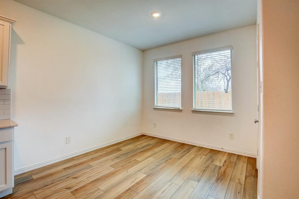 532 Ranchito Pass Haslet, TX 76052 - Photo 16 of 38 an empty room with wooden floor and windows