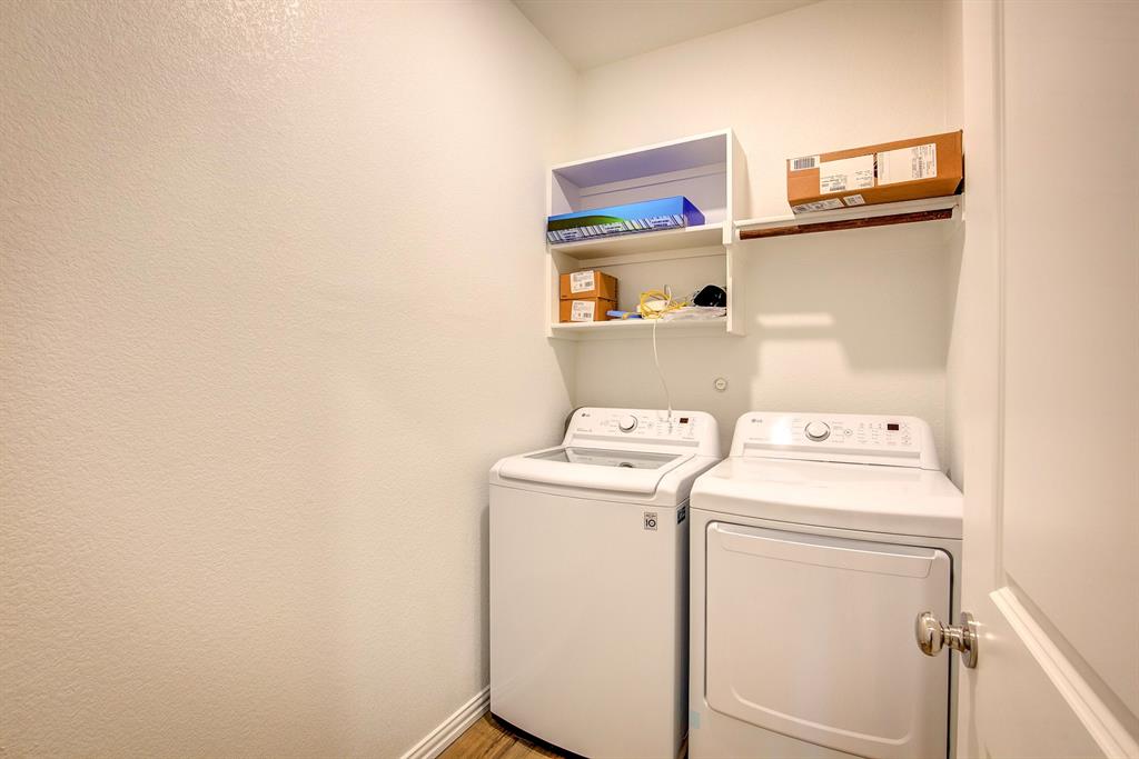 532 Ranchito Pass Haslet, TX 76052 - Photo 23 of 38 a utility room with dryer and washer