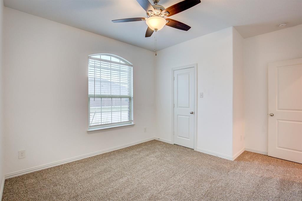 532 Ranchito Pass Haslet, TX 76052 - Photo 30 of 38 a view of a livingroom with a window and a ceiling fan