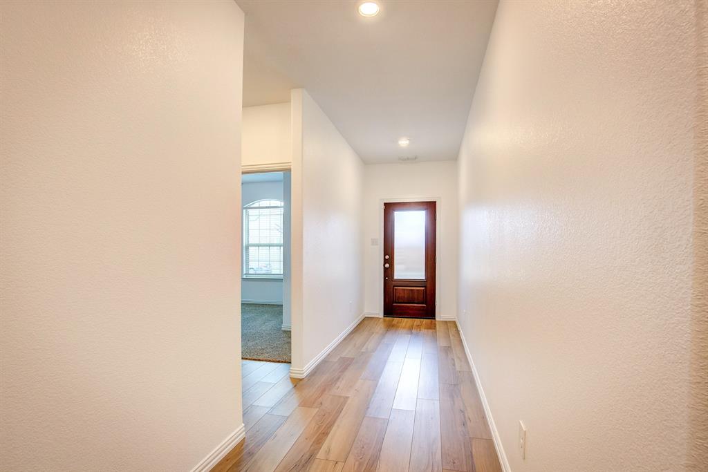 532 Ranchito Pass Haslet, TX 76052 - Photo 5 of 38 a view of hallway with wooden floor