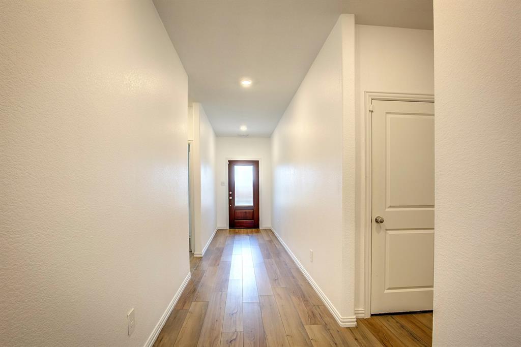 532 Ranchito Pass Haslet, TX 76052 - Photo 6 of 38 a view of hallway with wooden floor