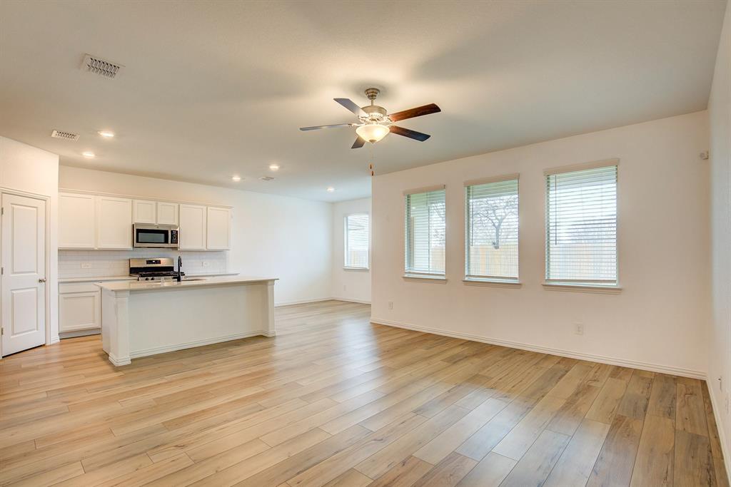 532 Ranchito Pass Haslet, TX 76052 - Photo 7 of 38 a view of kitchen with sink microwave and stove