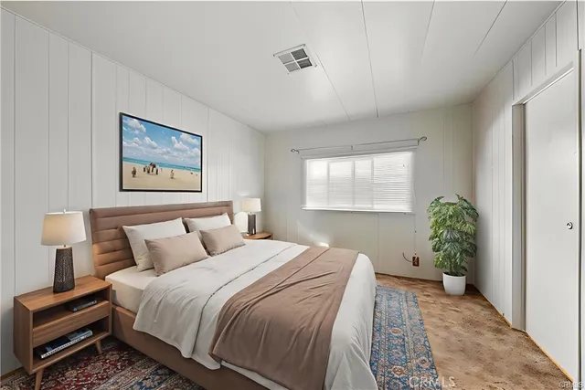 a bedroom with bed and a window