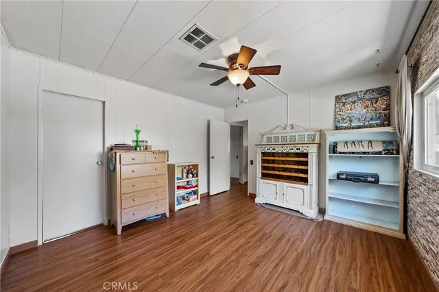 a view of room with furniture and wooden floor