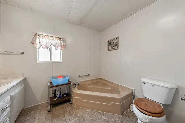 a bathroom with a toilet a sink and a bathtub