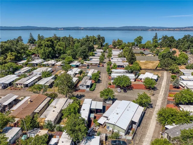 an aerial view of a house with a lake view