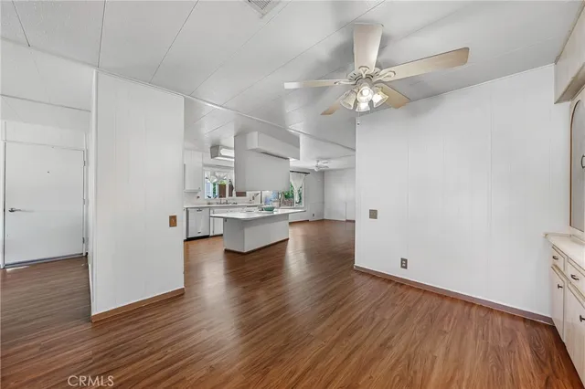 a view of kitchen with wooden floor and a window